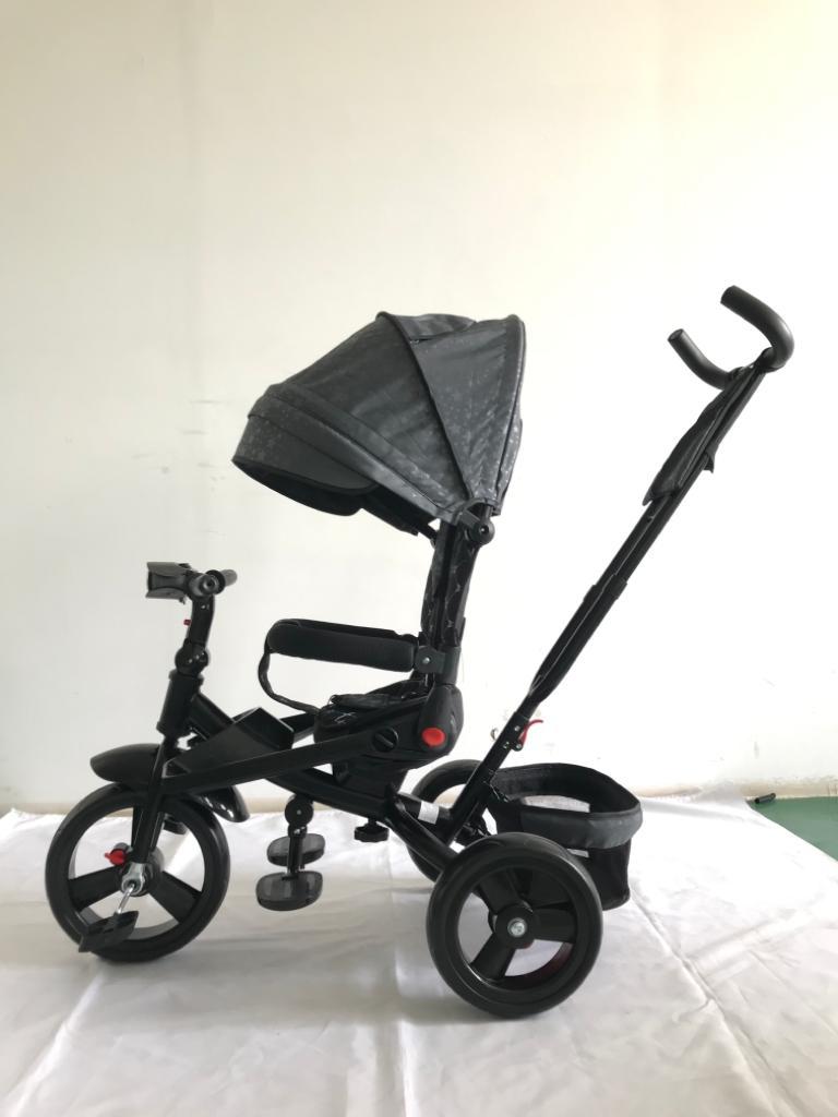 Tricicleta  plus 8 luni evolutiva, cu pozitie de somn, scaun rotativ si muzica distractiva, culoare GRI STEA,