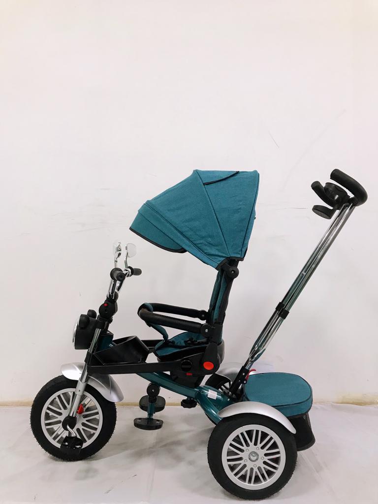 Tricicleta L-Sun SL03, cu pozitie de somn, scaun rotativ si muzica distractiva,roti cauciuc, culoare TURCOAZ,