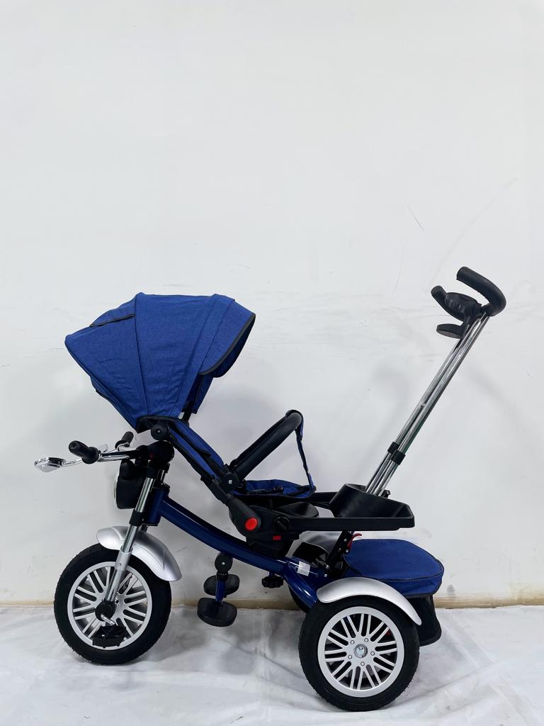 Tricicleta evolutiva, roti cauciuc, cu pozitie de somn, scaun rotativ si muzica distractiva, culoare ALBASTRU BBD5199A