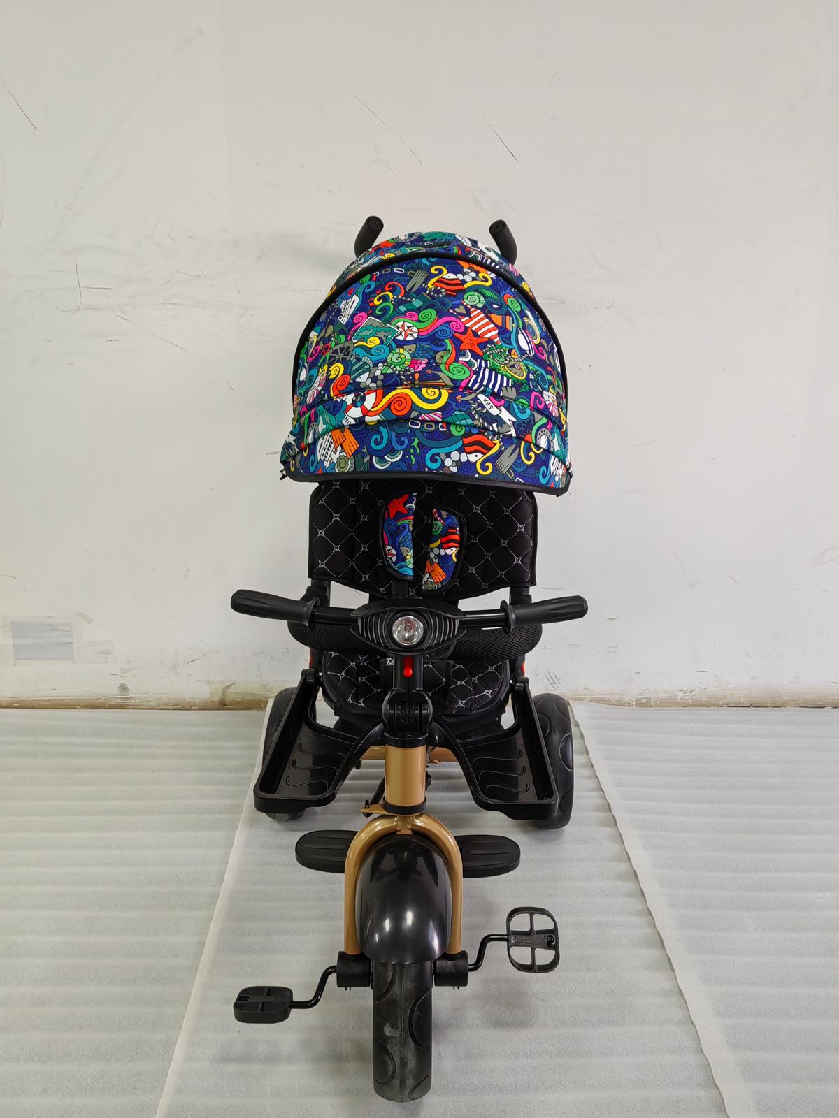 Tricicleta cu pozitie de somn, scaun rotativ si muzica distractiva, Multicolor